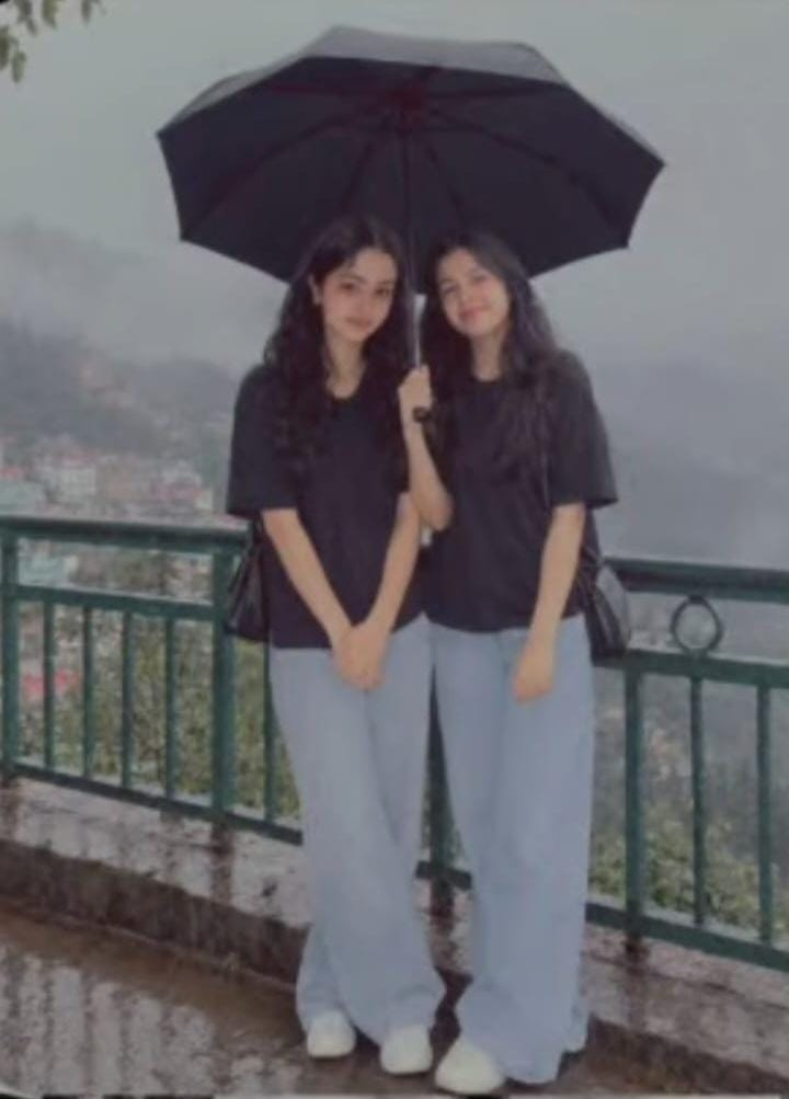 Payal with umbrella in the rain
